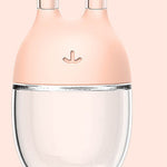 Pink and clear glass product on a pink background