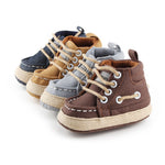 Set of four pairs of children's high-top sneakers in different colors on a white background