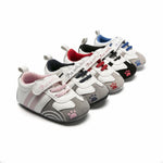 Set of children's shoes with paw prints on a white background
