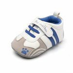 Baby shoe with blue and white design on a white background