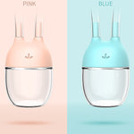 Two glass drink containers, one pink and one blue, on a split background.