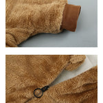 Brown fuzzy fabric with a zipper on a gray background