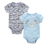 Two baby bodysuits, one gray with dog pattern and one blue with dog face design, on a white background.