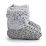 Gray knitted baby bootie with fluffy top on a white background